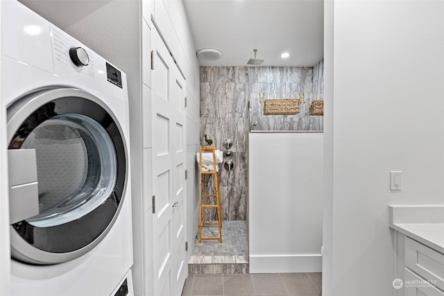 washroom featuring light tile patterned floors and washer / clothes dryer