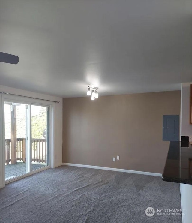 carpeted spare room with electric panel