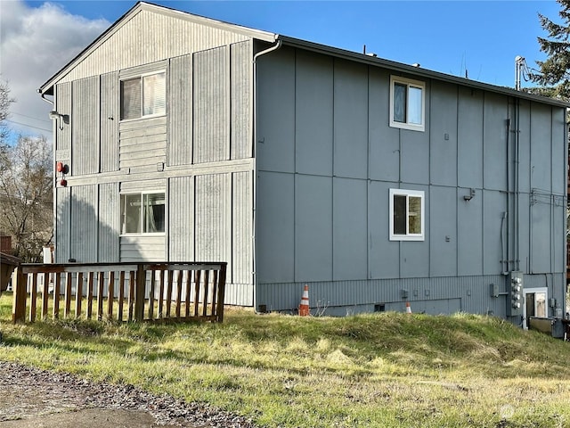 view of property exterior featuring a lawn