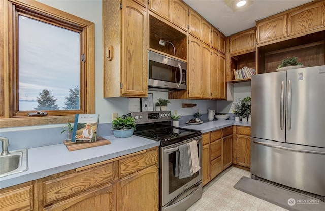 kitchen with appliances with stainless steel finishes and sink