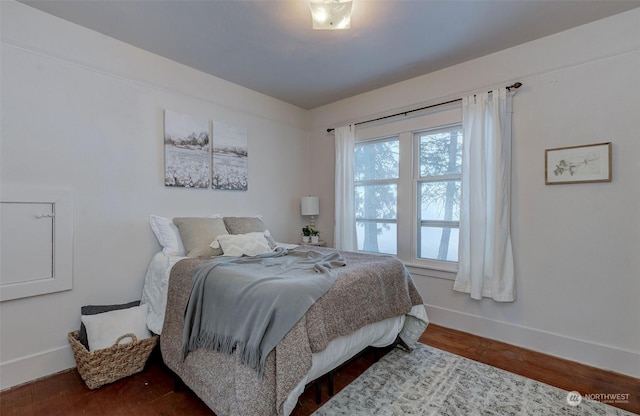 bedroom with hardwood / wood-style floors