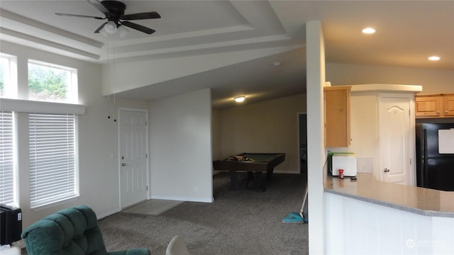 kitchen with pool table, black fridge, a raised ceiling, and carpet