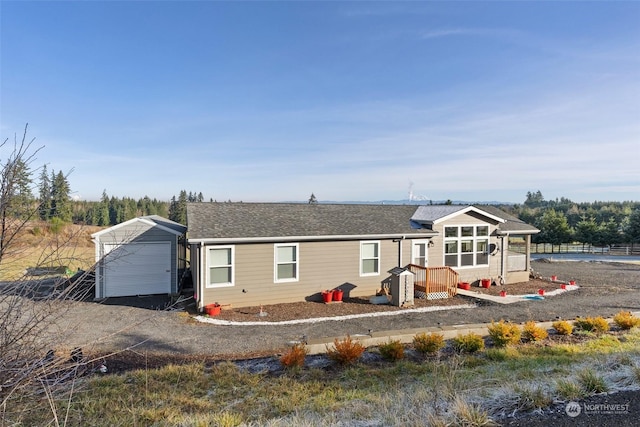 view of front of property with an outbuilding and a garage