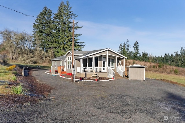 manufactured / mobile home featuring a shed and a sunroom