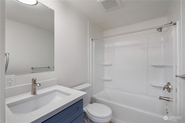 full bathroom featuring a textured ceiling, toilet, vanity, and  shower combination