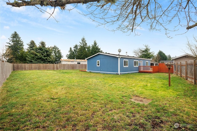 view of yard with a wooden deck