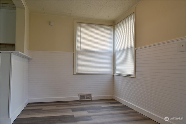 empty room with hardwood / wood-style floors