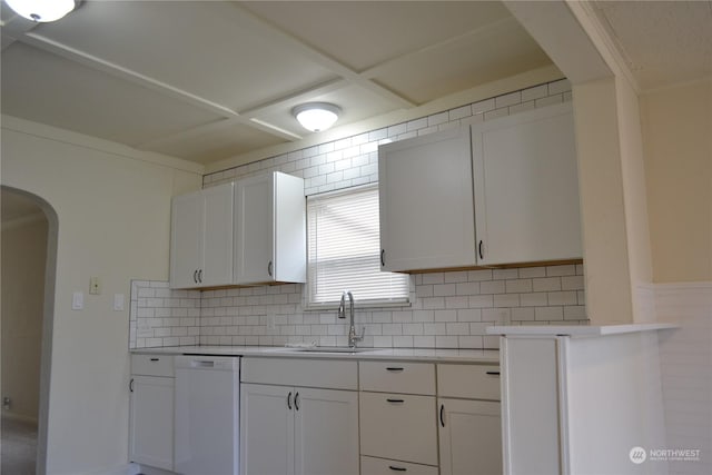 kitchen with white cabinets, dishwasher, backsplash, and sink