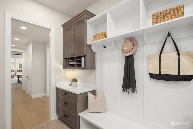 mudroom with light tile patterned flooring