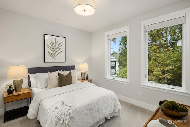 bedroom featuring light colored carpet