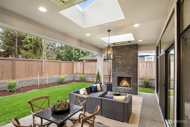 view of patio featuring an outdoor living space with a fireplace