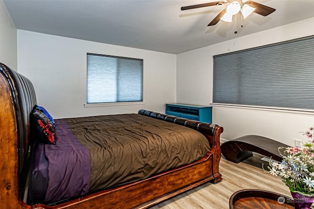 bedroom featuring ceiling fan and light hardwood / wood-style floors