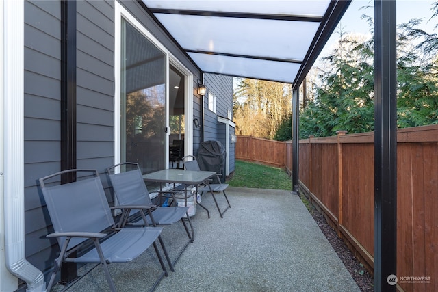 view of patio / terrace with outdoor dining space and a fenced backyard