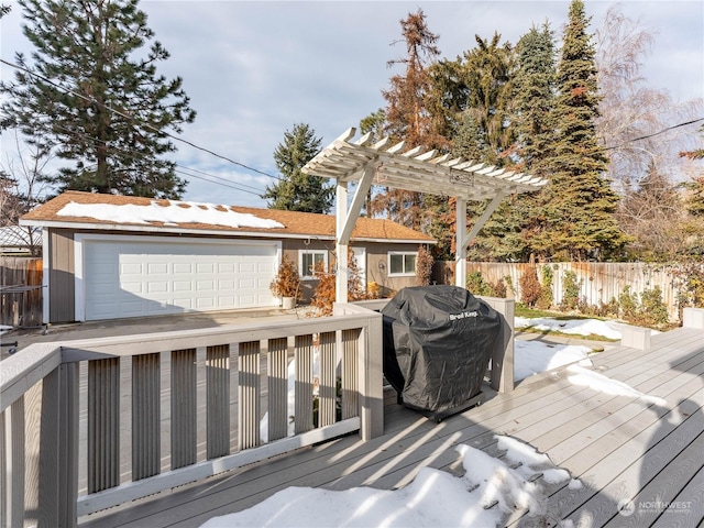 wooden terrace with a grill and a pergola