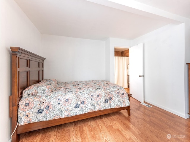 bedroom with light hardwood / wood-style floors