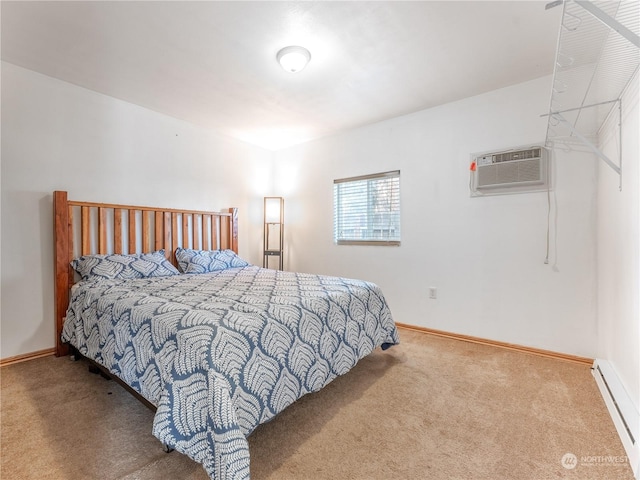 carpeted bedroom with a baseboard heating unit and a wall mounted air conditioner