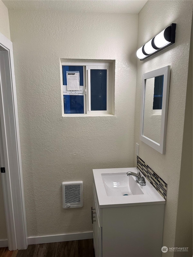 bathroom with vanity and wood-type flooring