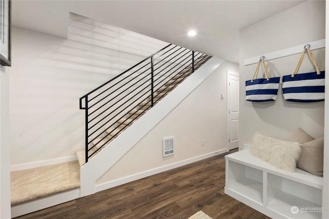 staircase featuring hardwood / wood-style floors