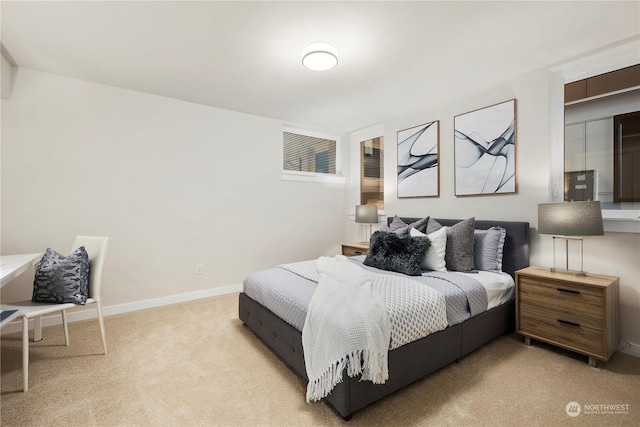 bedroom featuring light carpet