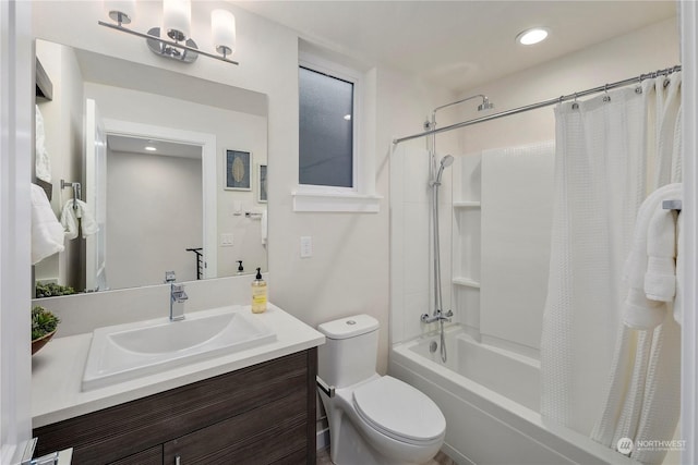 full bathroom with toilet, vanity, and shower / tub combo with curtain