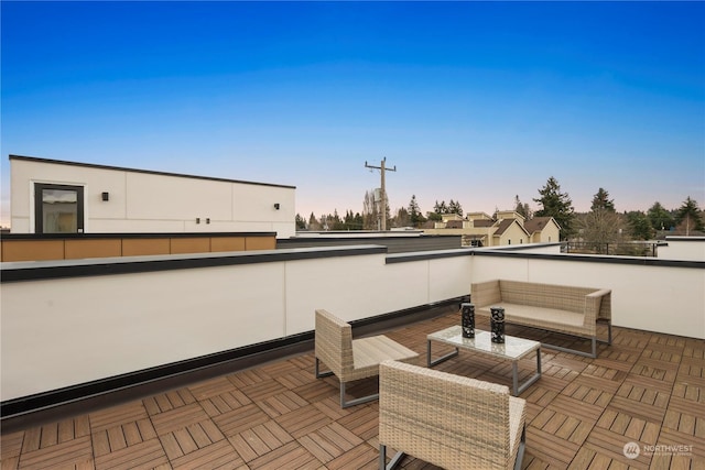 patio terrace at dusk with a balcony