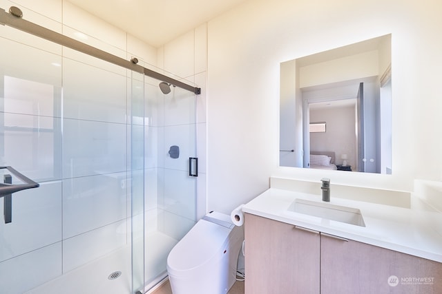 bathroom featuring an enclosed shower, vanity, and toilet