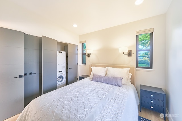 bedroom with stacked washer and dryer