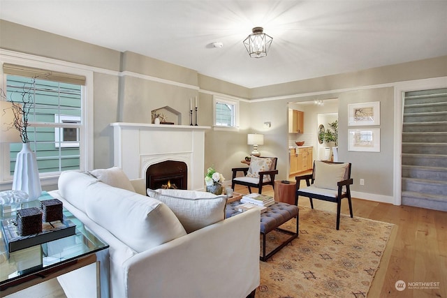 living room with light hardwood / wood-style flooring