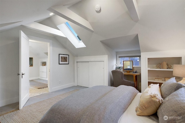 bedroom featuring vaulted ceiling and a closet