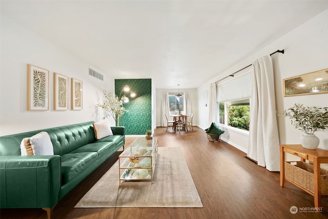 living room with dark hardwood / wood-style flooring