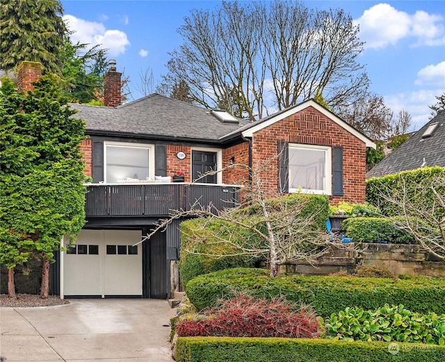 view of front of house featuring a balcony and a garage