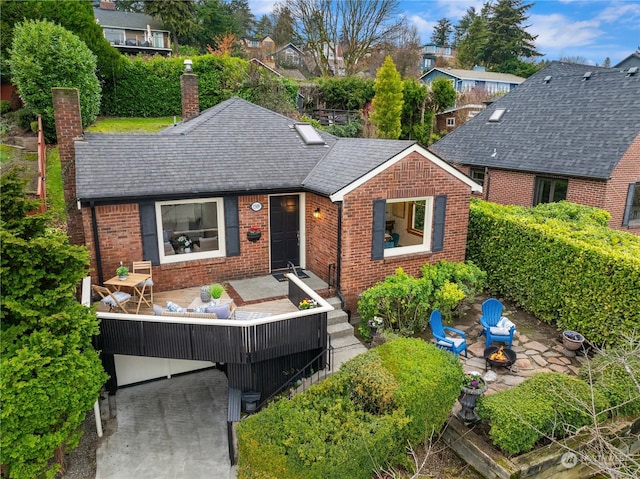 view of front of home featuring an outdoor fire pit and a patio