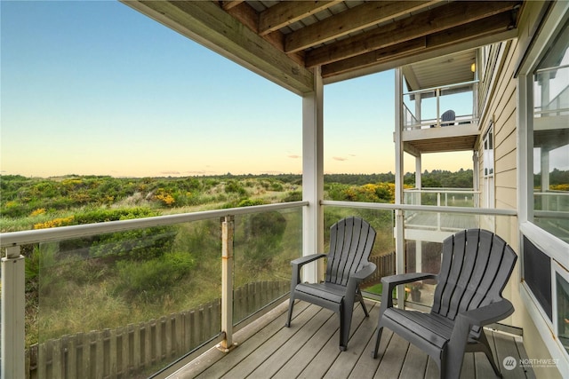 view of balcony at dusk