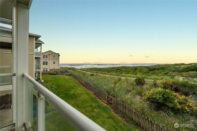 balcony at dusk with a water view