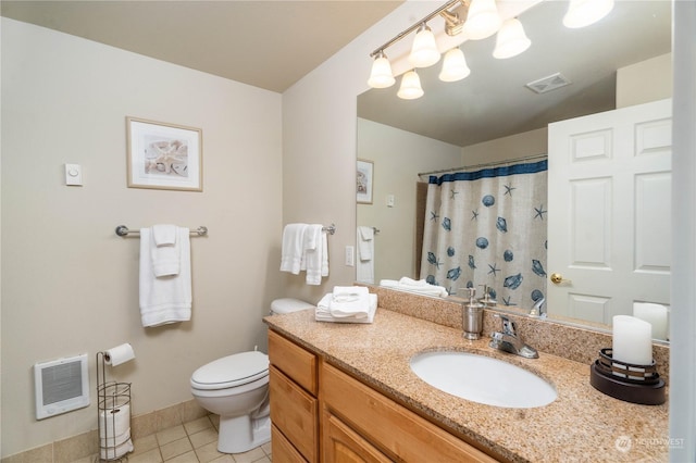 bathroom featuring heating unit, toilet, walk in shower, vanity, and tile patterned floors