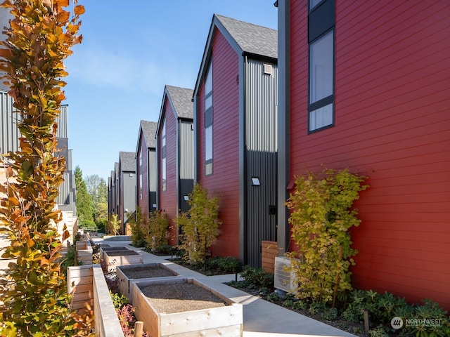 view of side of home featuring central AC unit