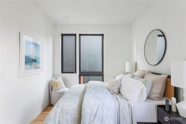 bedroom with light hardwood / wood-style flooring