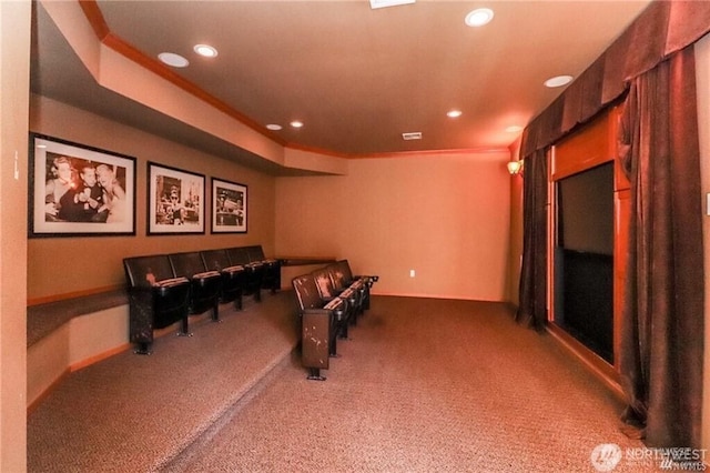 carpeted cinema room with recessed lighting and crown molding