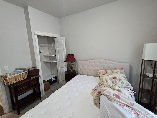 carpeted bedroom featuring a closet