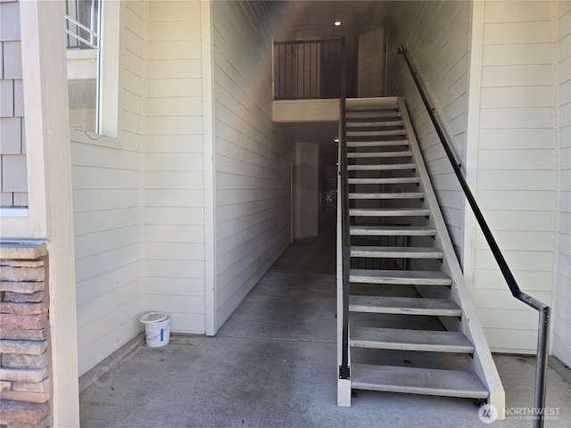 stairway with wooden walls