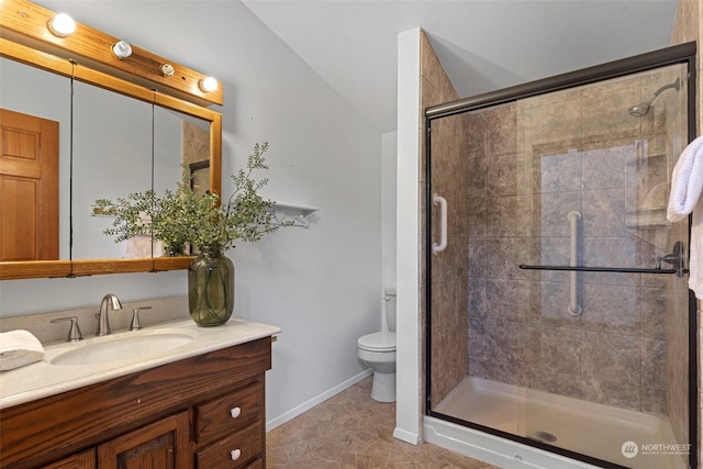 bathroom featuring lofted ceiling, toilet, walk in shower, tile patterned floors, and vanity