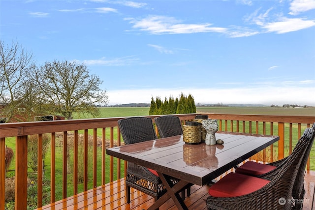 wooden terrace featuring a rural view