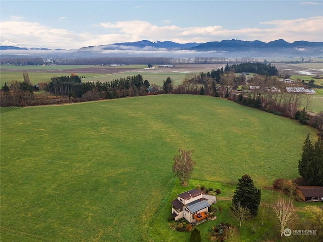 drone / aerial view featuring a rural view and a mountain view