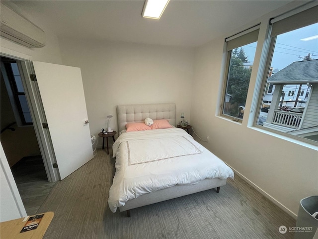 bedroom featuring a wall mounted air conditioner