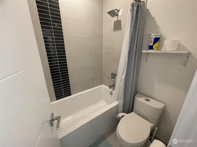 bathroom with shower / tub combo and toilet