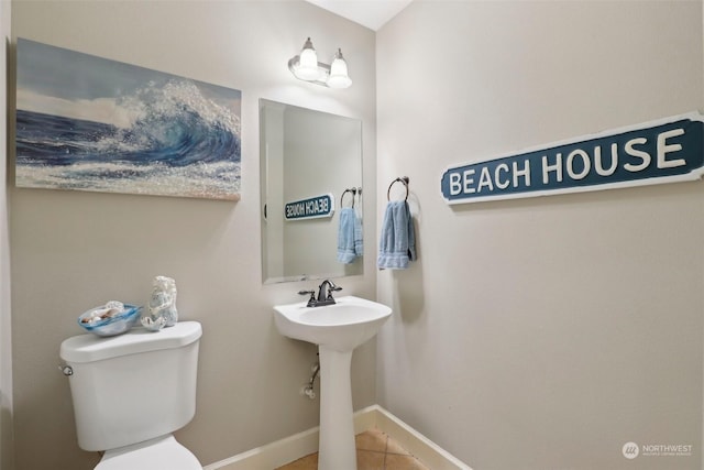 bathroom with tile patterned floors and toilet