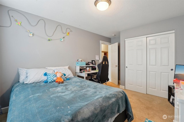 carpeted bedroom featuring a closet