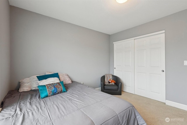 carpeted bedroom with a closet