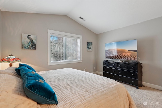 carpeted bedroom featuring vaulted ceiling