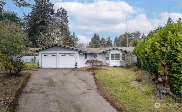 ranch-style house featuring a garage